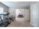 Bright bonus room features a treadmill, keyboard, and comfortable sitting area at 5039 Penn Rd, Iron Station, NC 28080