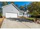 Exterior front of a single-story home with two-car garage and light blue siding at 5039 Penn Rd, Iron Station, NC 28080