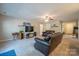 Inviting living room with plush seating, modern entertainment setup, and a cozy atmosphere at 5039 Penn Rd, Iron Station, NC 28080