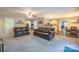 Open concept living room with seamless flow to the kitchen and dining areas; neutral color scheme at 5039 Penn Rd, Iron Station, NC 28080
