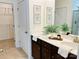 Well-lit bathroom with double vanity, modern fixtures, framed mirrors, and easy access to the walk-in closet at 1032 Bull Dog Ln, Wingate, NC 28174