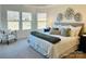 Serene main bedroom with tray ceilings, large windows, neutral decor, and lots of natural light at 1032 Bull Dog Ln, Wingate, NC 28174