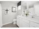 Clean bathroom with double vanity, white cabinets, and a shower/tub combo at 1933 Stephens Farm Dr, China Grove, NC 28023