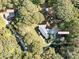 Aerial view showing home, detached garage, and additional building on wooded lot at 316 Carter Rd, Monroe, NC 28110