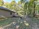 House backyard with wooded area and small deck at 316 Carter Rd, Monroe, NC 28110