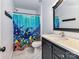 Bathroom with a shower/tub, vanity, and ocean-themed decor at 316 Carter Rd, Monroe, NC 28110