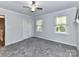 Spacious bedroom with carpet, ceiling fan, and neutral walls at 316 Carter Rd, Monroe, NC 28110