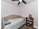 Small bedroom with twin daybed and built-in shelving at 316 Carter Rd, Monroe, NC 28110