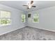 Bright bedroom with carpet, ceiling fan, and window blinds at 316 Carter Rd, Monroe, NC 28110