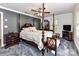 Main bedroom with a post bed, carpet flooring and a TV at 316 Carter Rd, Monroe, NC 28110