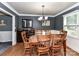 Dining room with hardwood floors and wood table with chairs at 316 Carter Rd, Monroe, NC 28110