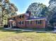 Brick home with a large yard and mature trees at 316 Carter Rd, Monroe, NC 28110