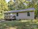 Tan house with a wooden deck and steps at 316 Carter Rd, Monroe, NC 28110