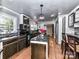 Renovated kitchen, featuring stainless steel appliances and granite countertops at 316 Carter Rd, Monroe, NC 28110