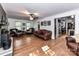 Spacious living room with hardwood floors, a wood-burning stove and leather furniture at 316 Carter Rd, Monroe, NC 28110