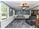 Living room with gray walls, carpet, and comfortable seating at 316 Carter Rd, Monroe, NC 28110