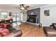 Bright living room with hardwood floors, wood-burning stove and French doors at 316 Carter Rd, Monroe, NC 28110