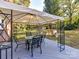 Covered patio with table and chairs, overlooks yard at 316 Carter Rd, Monroe, NC 28110