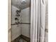 Updated shower with stone accents and a shower curtain at 316 Carter Rd, Monroe, NC 28110