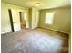 Bright bedroom with carpeting and access to another room at 503 Broad St, Kings Mountain, NC 28086