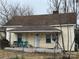 Charming yellow house with a covered porch and fenced yard at 503 Broad St, Kings Mountain, NC 28086