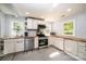 Updated kitchen with butcher block countertops and white cabinets at 1378 8Th Nw St, Hickory, NC 28601