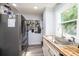 Updated kitchen with stainless steel refrigerator and wood countertop at 1378 8Th Nw St, Hickory, NC 28601