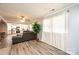 Living room with gray sectional sofa, view into kitchen, and hardwood floors at 1378 8Th Nw St, Hickory, NC 28601