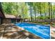 Inviting backyard oasis featuring a refreshing pool, surrounded by lush greenery at 315 Camelot Dr, Salisbury, NC 28144