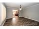 Formal dining room with hardwood floors and access to a sunlit library at 315 Camelot Dr, Salisbury, NC 28144