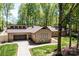 Home exterior showcasing a two-car garage and stone details at 315 Camelot Dr, Salisbury, NC 28144