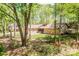 Ranch home with stone facade and lush landscaping on a wooded lot at 315 Camelot Dr, Salisbury, NC 28144