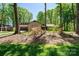 House exterior featuring stone and wood siding, a covered entryway, and mature trees at 315 Camelot Dr, Salisbury, NC 28144