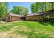 Stone and wood exterior, two-car garage, and a landscaped yard at 315 Camelot Dr, Salisbury, NC 28144