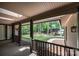 Relaxing front porch overlooking a wooded backyard at 315 Camelot Dr, Salisbury, NC 28144