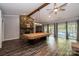 Game room featuring a pool table and stone fireplace, with access to the pool at 315 Camelot Dr, Salisbury, NC 28144