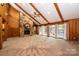 Living room with stone fireplace, vaulted ceiling and large windows at 315 Camelot Dr, Salisbury, NC 28144