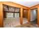 Spacious living room with high ceilings, wood paneling, and a view of the pool at 315 Camelot Dr, Salisbury, NC 28144