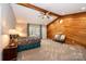 Main bedroom with wood-paneled accent wall and access to the backyard at 315 Camelot Dr, Salisbury, NC 28144