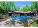 Rectangle inground pool in backyard with surrounding patio and trees at 315 Camelot Dr, Salisbury, NC 28144