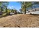 Large backyard featuring a storage shed and green foliage along the property lines at 3503 Linwood Rd, Gastonia, NC 28052