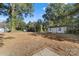 Spacious backyard featuring a storage shed and natural foliage along the property lines at 3503 Linwood Rd, Gastonia, NC 28052