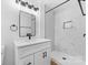 Modern bathroom features a vanity with quartz countertop and tiled shower at 3503 Linwood Rd, Gastonia, NC 28052