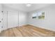 Bright bedroom with light colored walls and wood-look floors at 3503 Linwood Rd, Gastonia, NC 28052