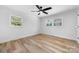 Bedroom with hardwood style flooring and large windows allowing for natural light at 3503 Linwood Rd, Gastonia, NC 28052