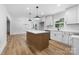 Bright, open kitchen featuring an island, stainless steel appliances, and hardwood floors at 3503 Linwood Rd, Gastonia, NC 28052