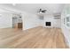 Spacious living room featuring a ceiling fan, fireplace, and built-in shelving at 3503 Linwood Rd, Gastonia, NC 28052