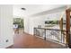 Side porch boasting an intricate brick floor, white walls, black railings, and views of the property at 3503 Linwood Rd, Gastonia, NC 28052