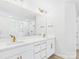 This bathroom is well-lit, featuring dual sinks, a large mirror, and a glass-enclosed shower with gold fixtures and hardware at 48 Sherwood Nw Ct # Sw48, Concord, NC 28027
