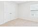 A clean bedroom with a double door closet and a window for natural light at 48 Sherwood Nw Ct # Sw48, Concord, NC 28027